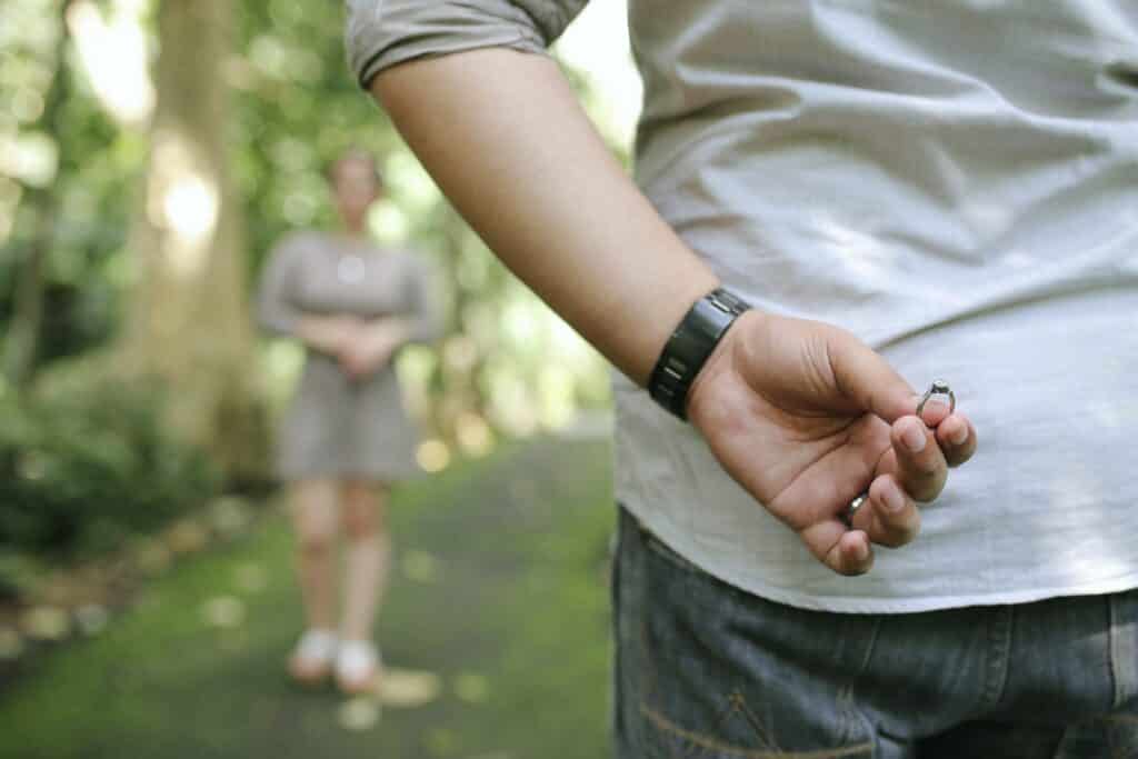 a man hiding his engagement ring