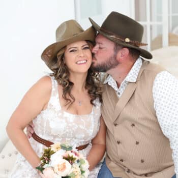 Newlywed couple posing inside modern Las Vegas wedding chapel
