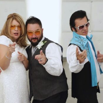 Newlywed couple posing inside modern Las Vegas wedding chapel
