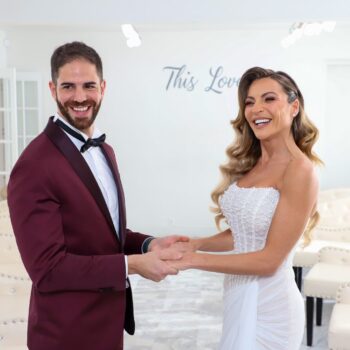 Bride and groom holding hands and smiling in Las Vegas wedding chapel