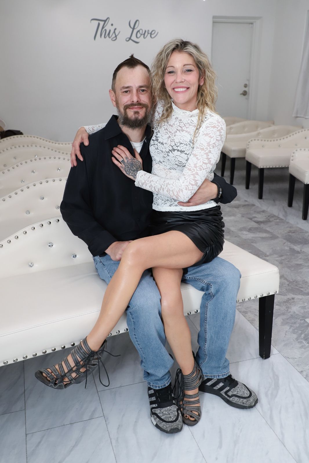 las-vegas-wedding-chapel-couple-seated-portrait-15 Couple seated together smiling inside elegant Las Vegas chapel