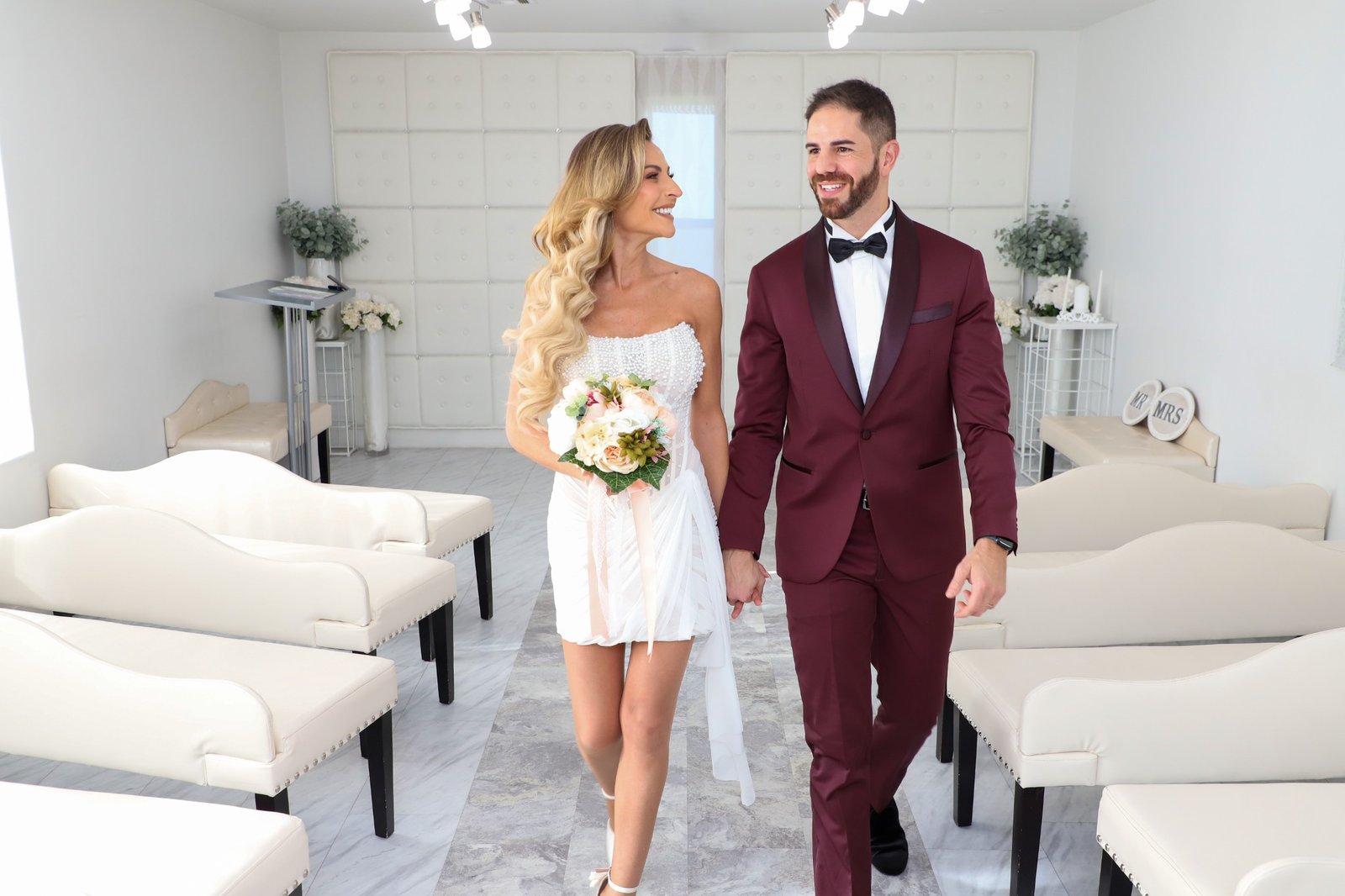 Bride and groom walking through chapel aisle after Las Vegas wedding