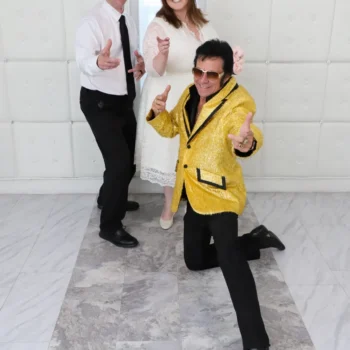 Elvis posing with couple after same day wedding Las Vegas chapel