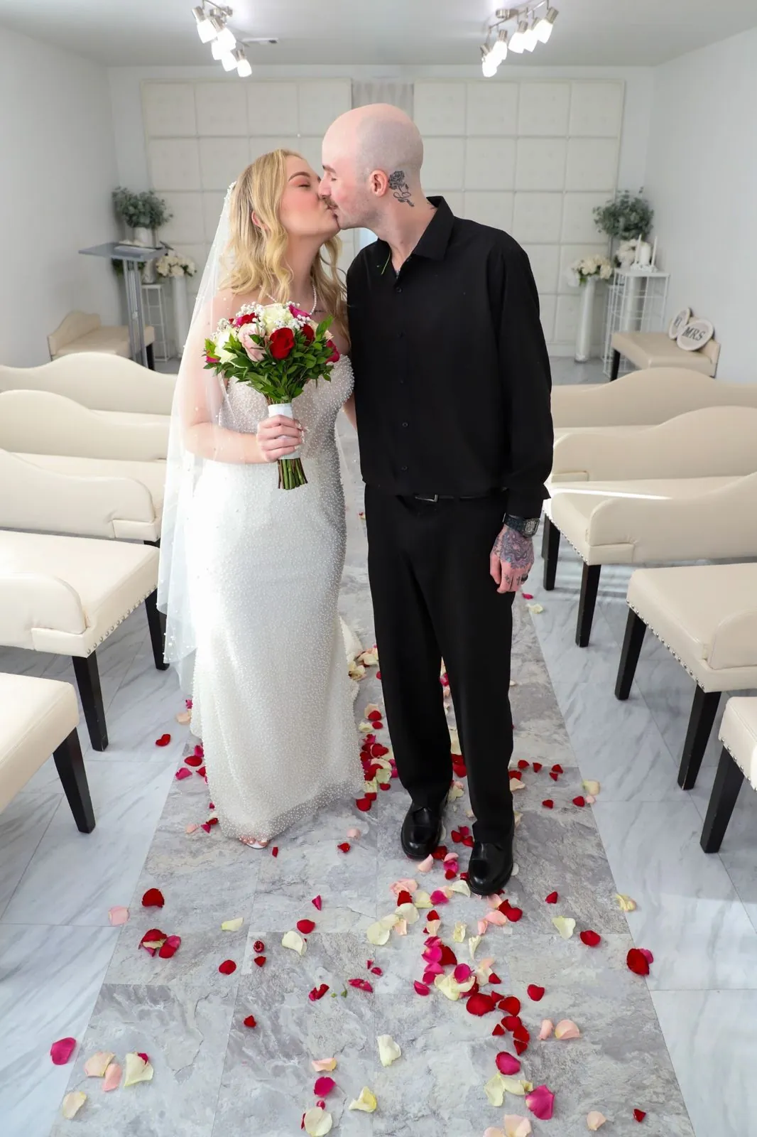 Bride and groom kissing in Las Vegas wedding chapel after same day wedding ceremony