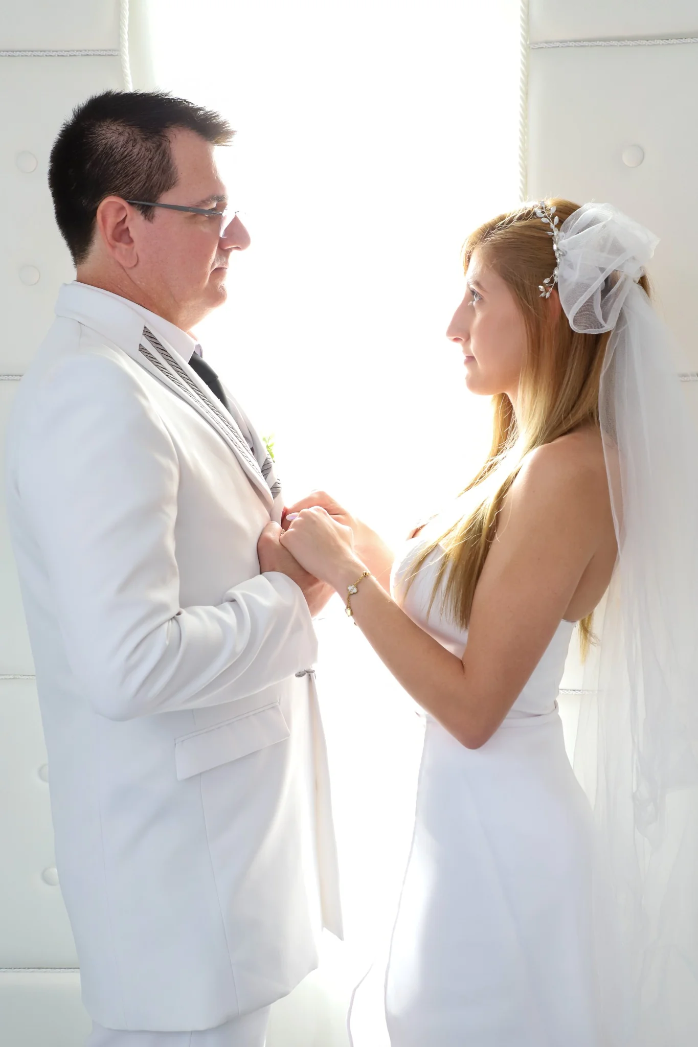 Couple holding hands during Las Vegas wedding ceremony