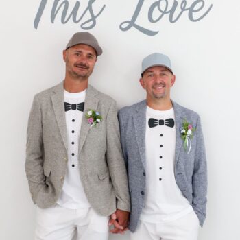 Same sex couple posing inside Las Vegas wedding chapel