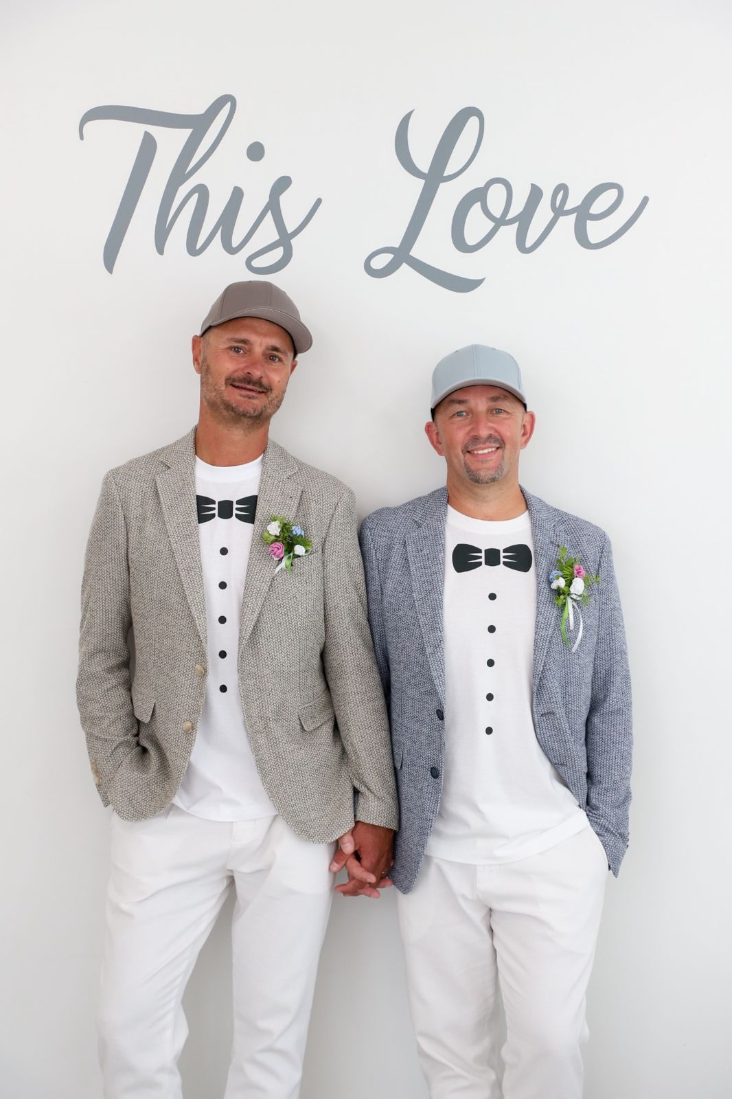 Same sex couple posing inside Las Vegas wedding chapel