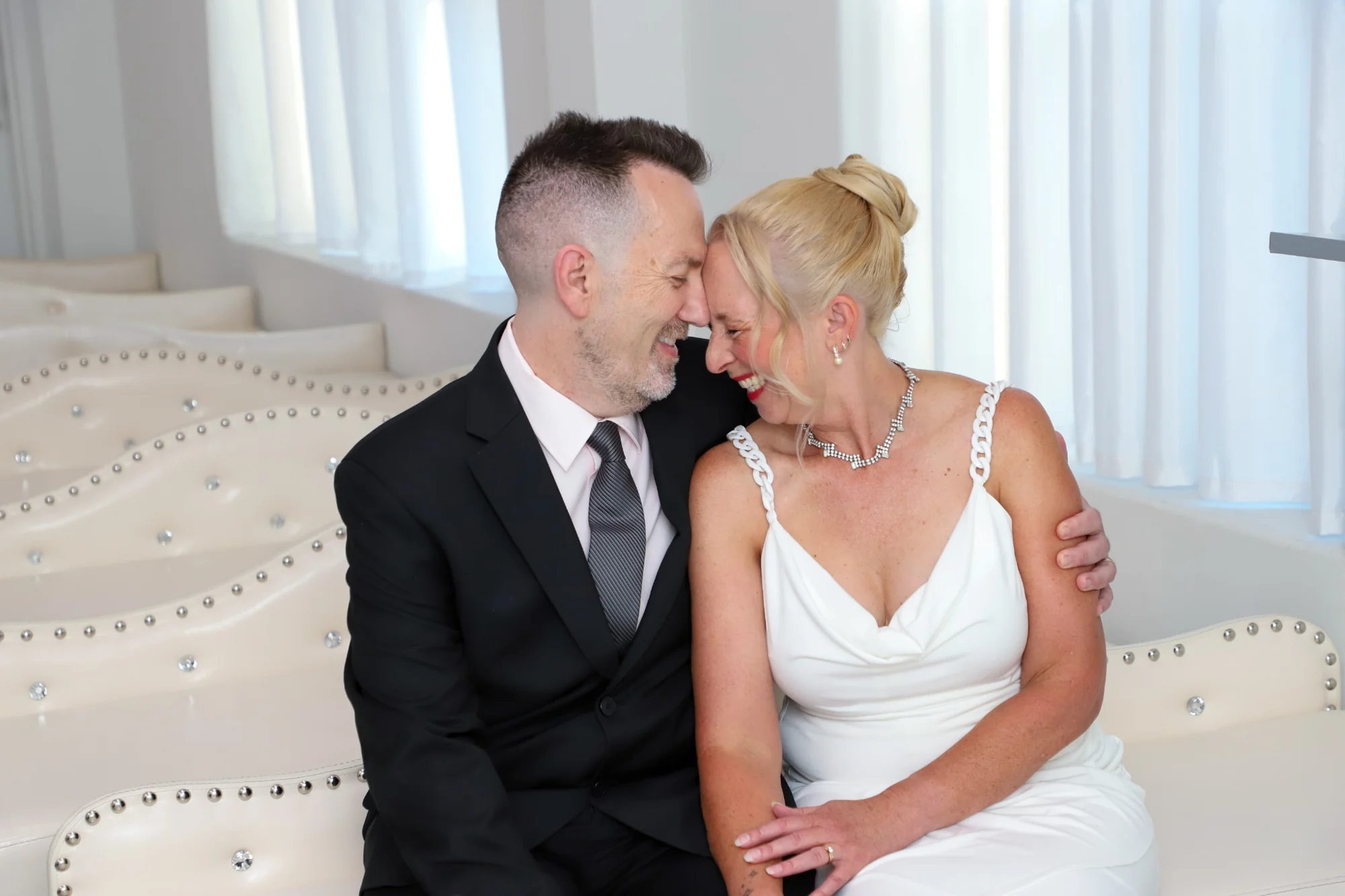 Bride and groom laughing together Las Vegas wedding