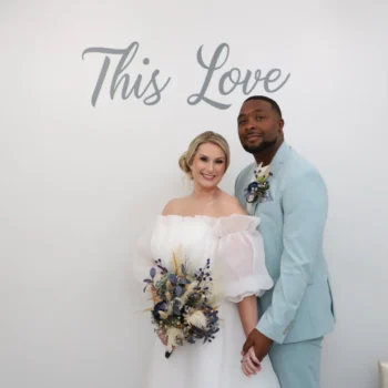 Newlywed couple posing inside modern Las Vegas wedding chapel