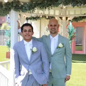 Same-day wedding couple posing beneath a decorated gazebo at a Las Vegas wedding chapel.